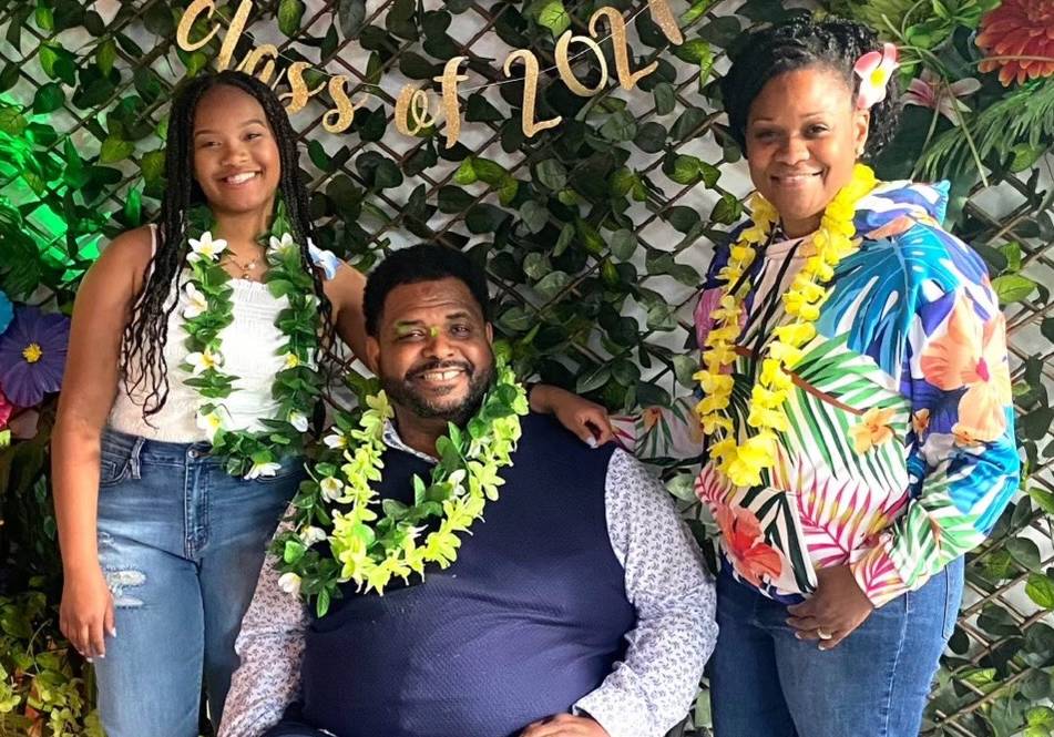 Rafael Hines with his wife and daughter