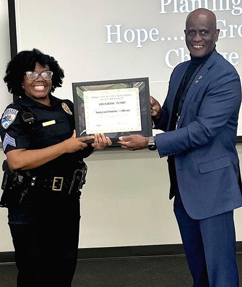  Sergeant McHenry (pictured left) received the MCCPD Lifesaving Award from Chief Jamerson (pictured right)